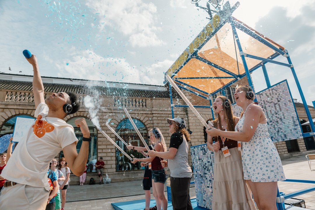 people enjoying the sunshine while taking part in sound board