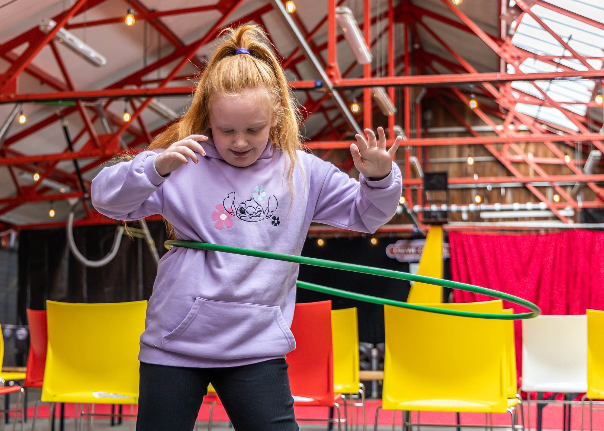 A child hula hooping