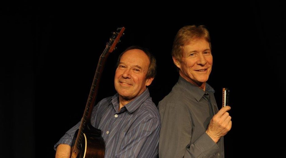 Dave Kelly with a guitar and Paul Jones with a harmonica