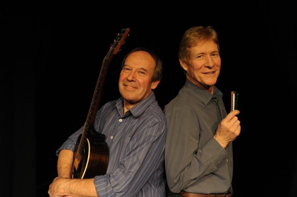 Dave Kelly with a guitar and Paul Jones with a harmonica