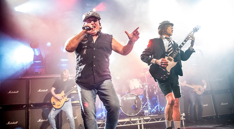 Cover band on stage with instruments