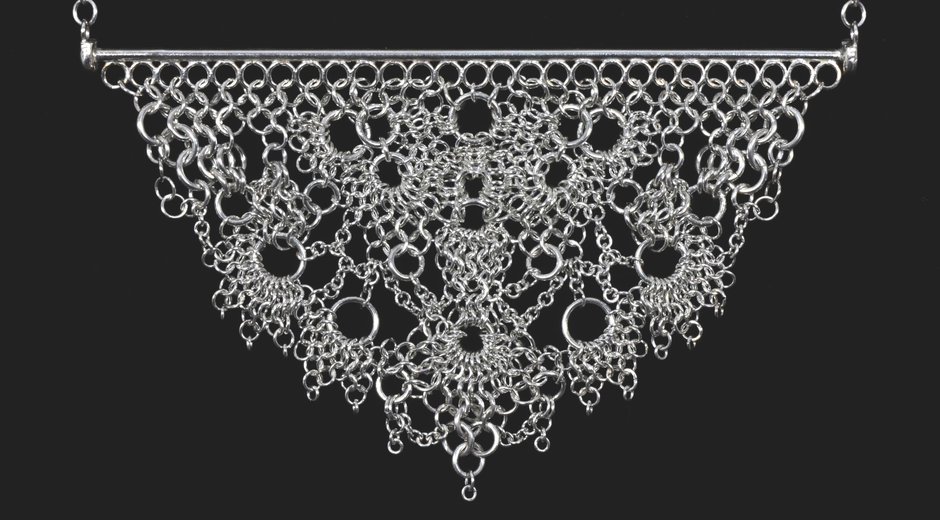 It’s a piece of handcrafted chainmail jewelry — delicate, symmetrical, and impressively intricate
