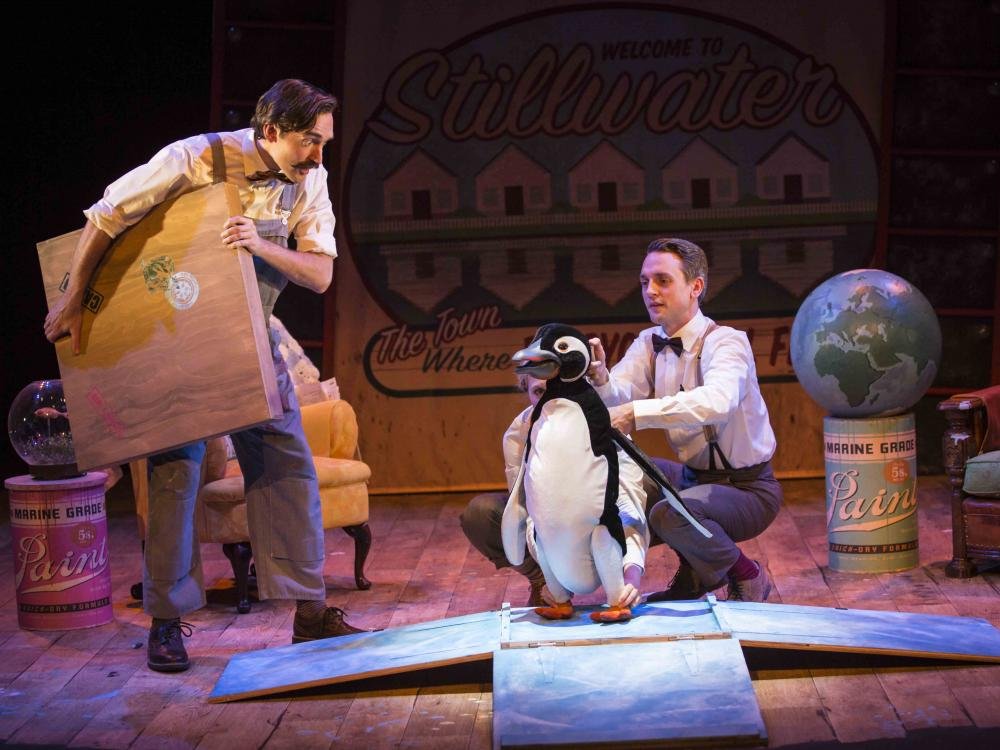 Man looking at penguin