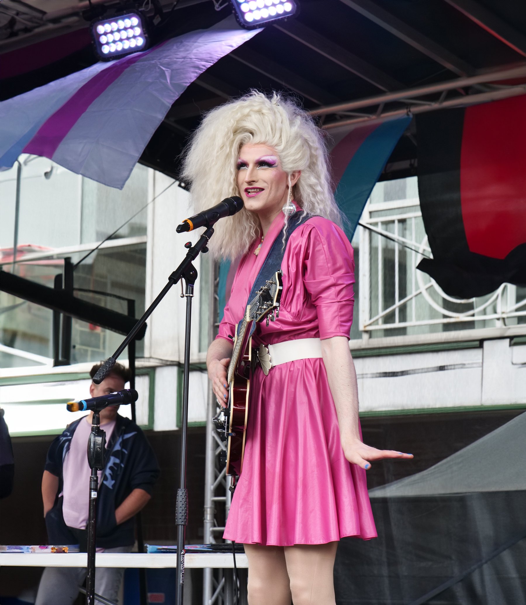 A drag queen wearing a fabulous pink frock