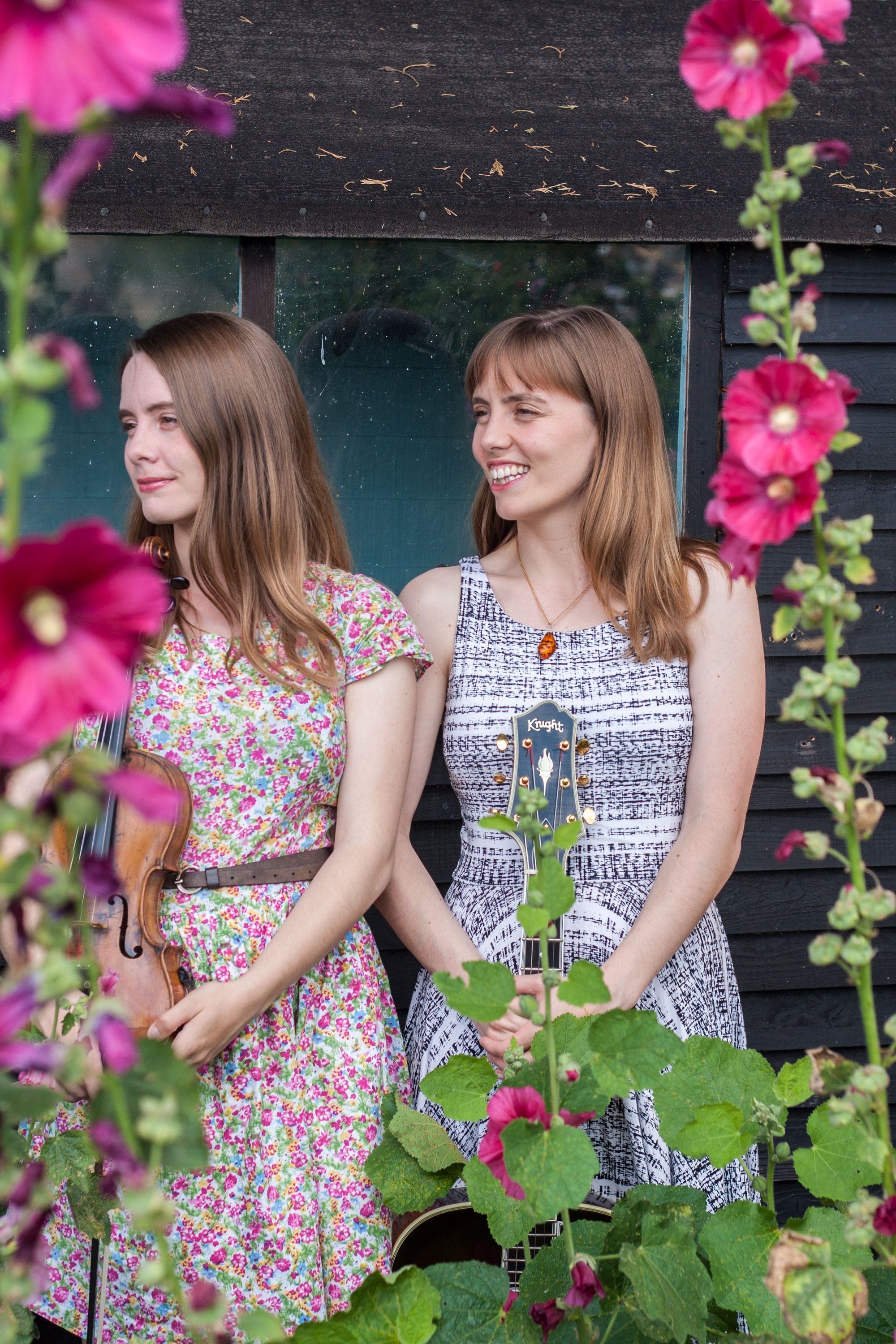 The Carrivick Sisters - Smiling outside shed