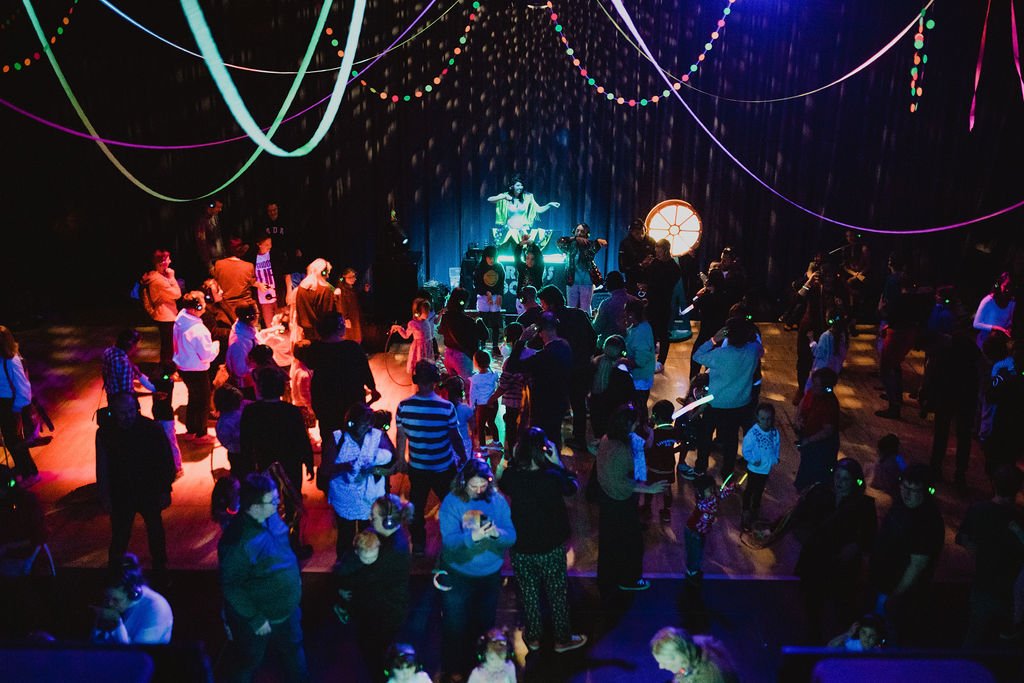 a crowd of children raving