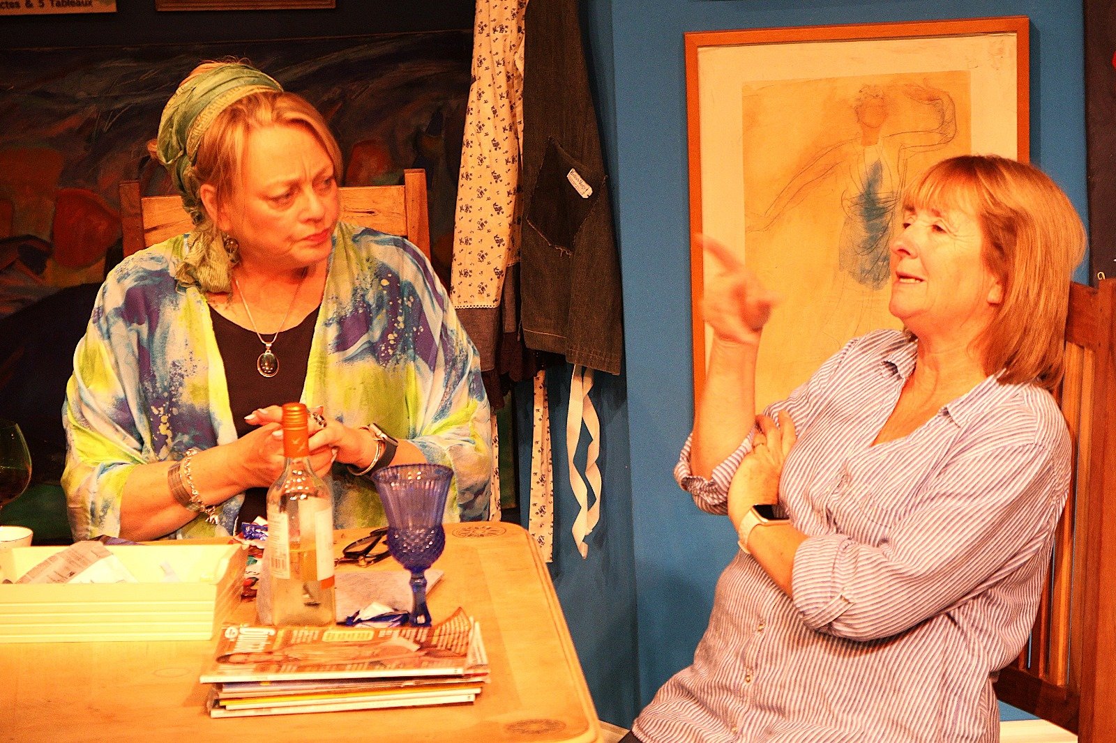 Cast all at dining table talking